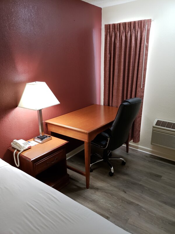 Image showing a work desk and chair in a room at the Travel Inn of Buford. 
