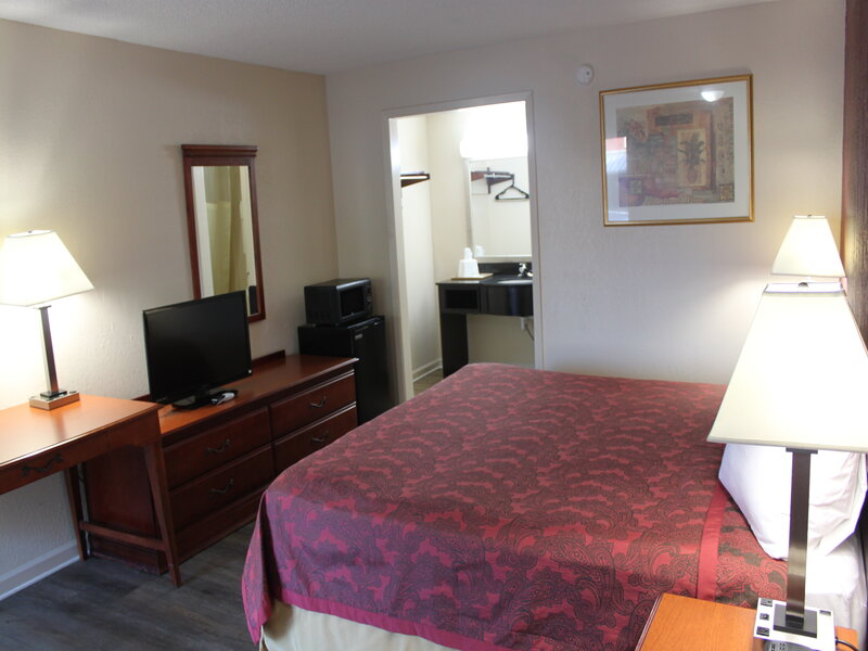 King Room showing a king bed, as well as the furniture in the room. 